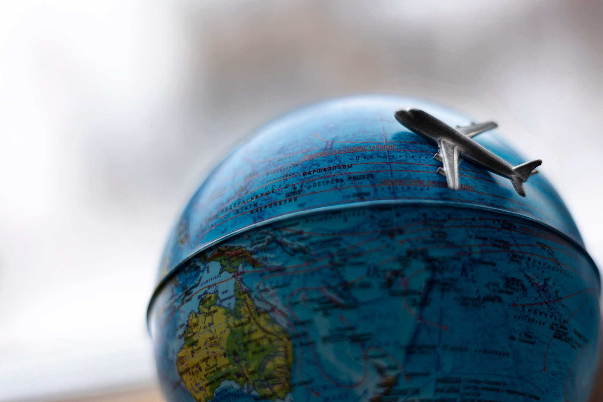 The globe on which the plane is flying on a journey